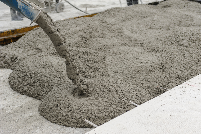 mixed concrete pouring at construction site